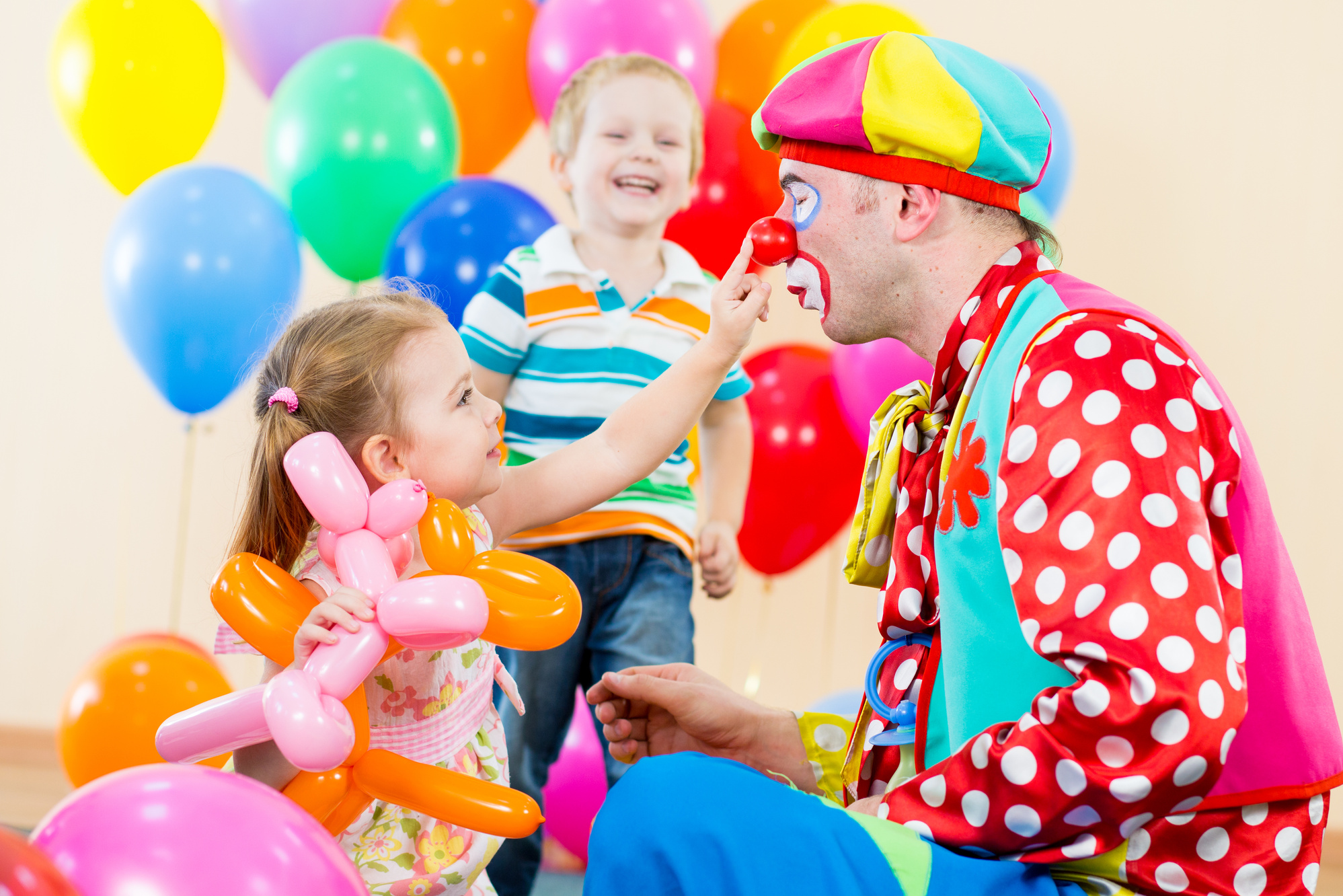 happy children and clown on birthday party